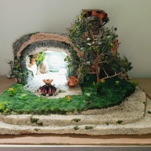 Portal con cueva, posada, jardín y fogata